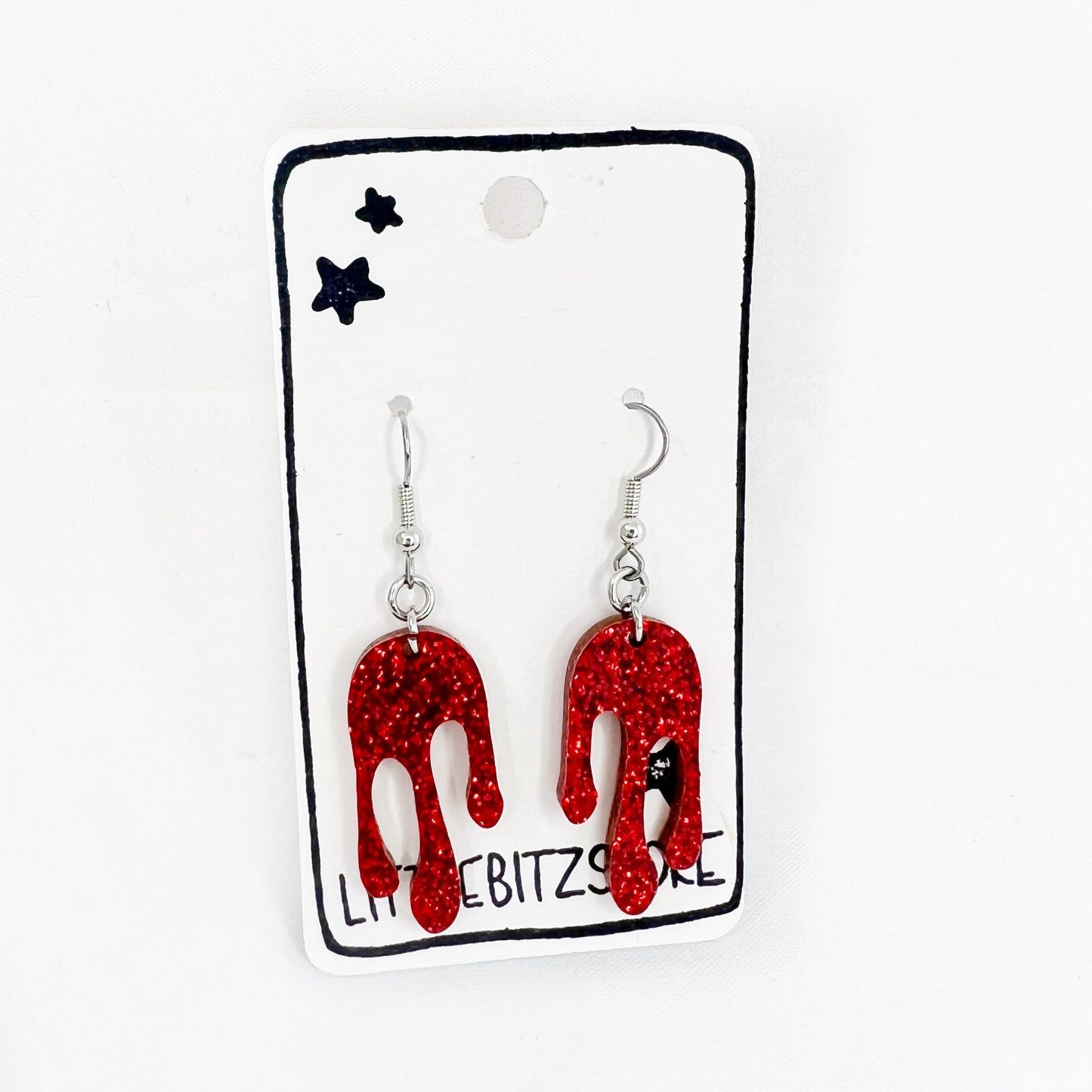 “drippy” acrylic earrings - ruby slipper - surgical steel