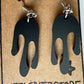Transparent matte black colored earrings in a drip design, made with acrylic and surgical stainless steel