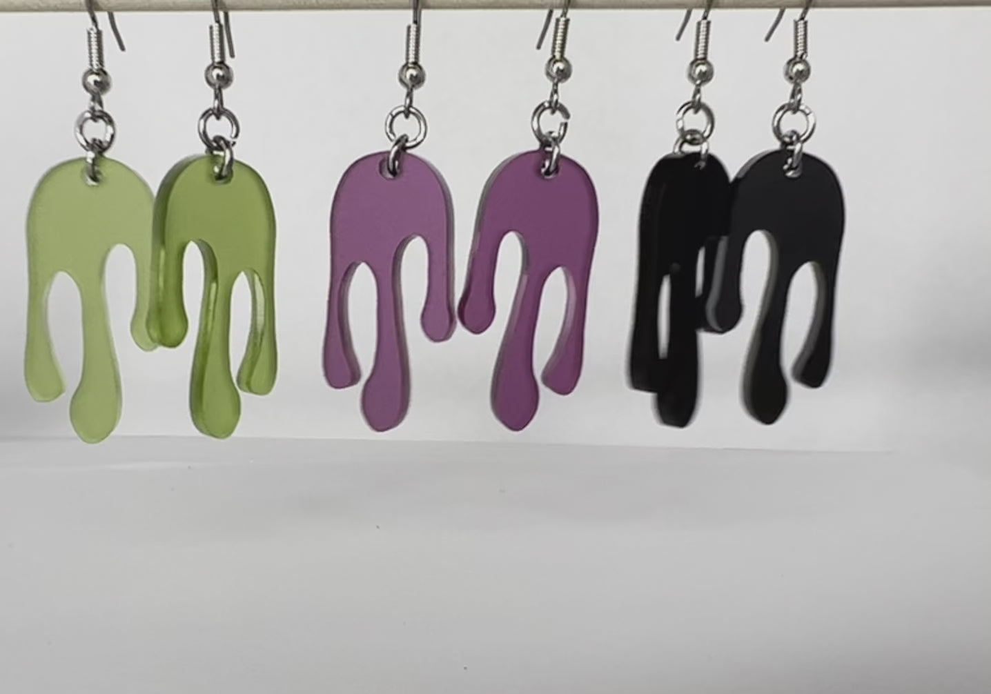 Drip earring design in matte color ways. Matte olive, matte plum, and matte black